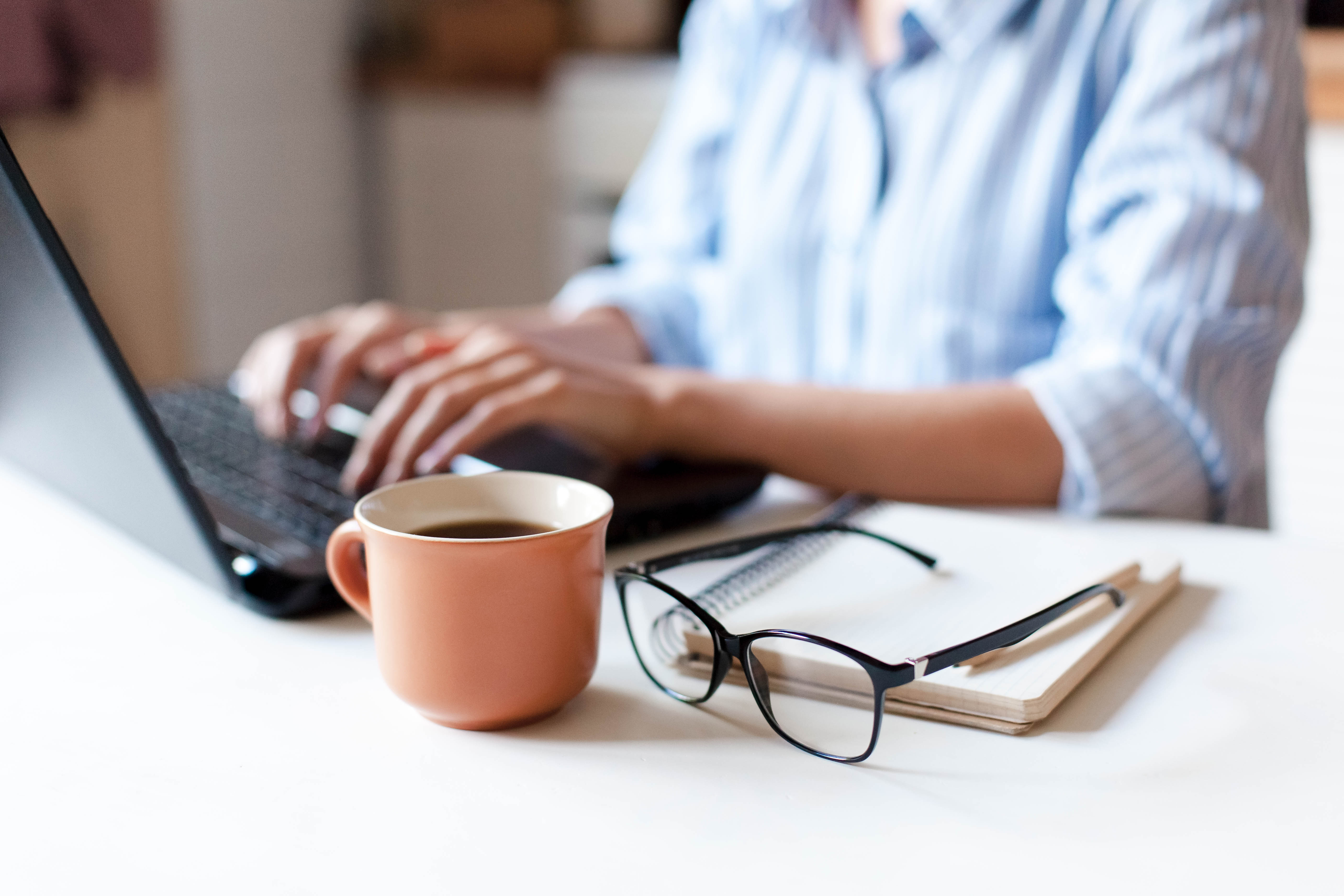 Woman working at laptop, Dell Technologies | DXC Technology